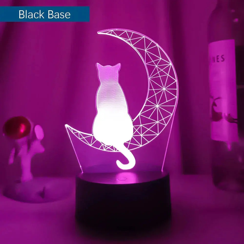Acrylic night light showing a cat sitting on a crescent moon, glowing in soft pink
