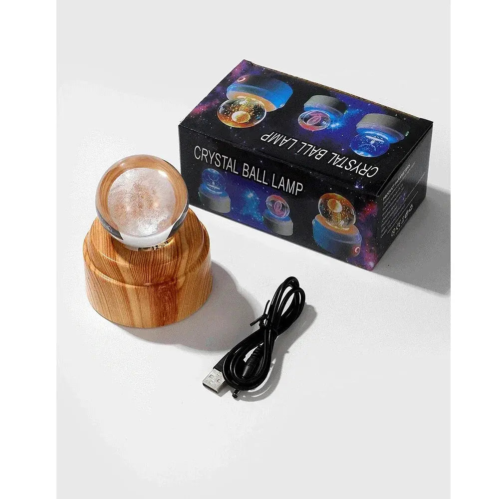 3D LED crystal lamp with a realistic moon engraving, glowing softly on a natural wooden base.