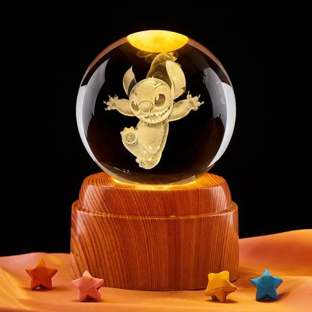 Crystal ball lamp featuring a glowing 3D moon, elegantly placed on a wooden stand.