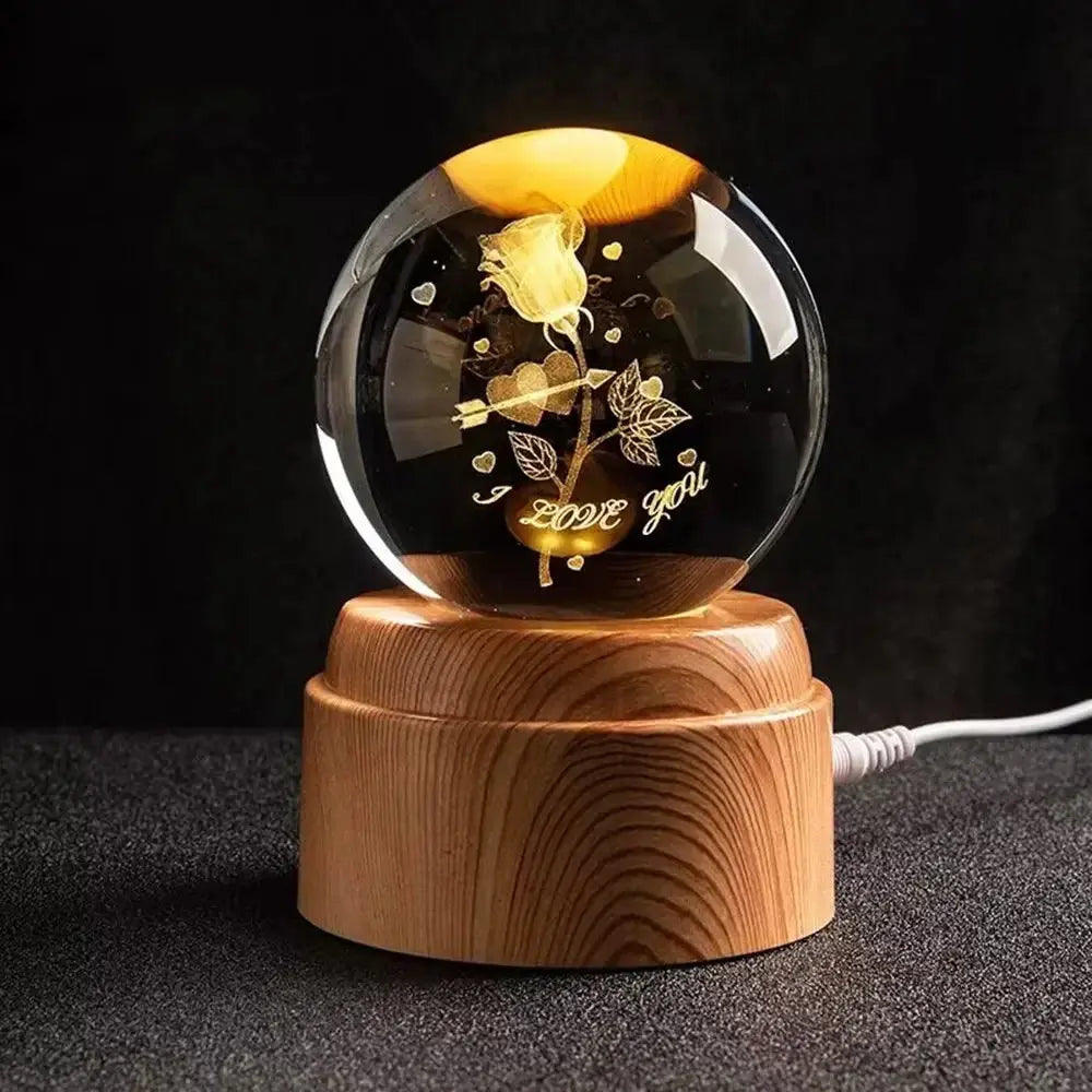 Engraved crystal ball with moon design glowing warmly — a magical night light for children or space lovers.