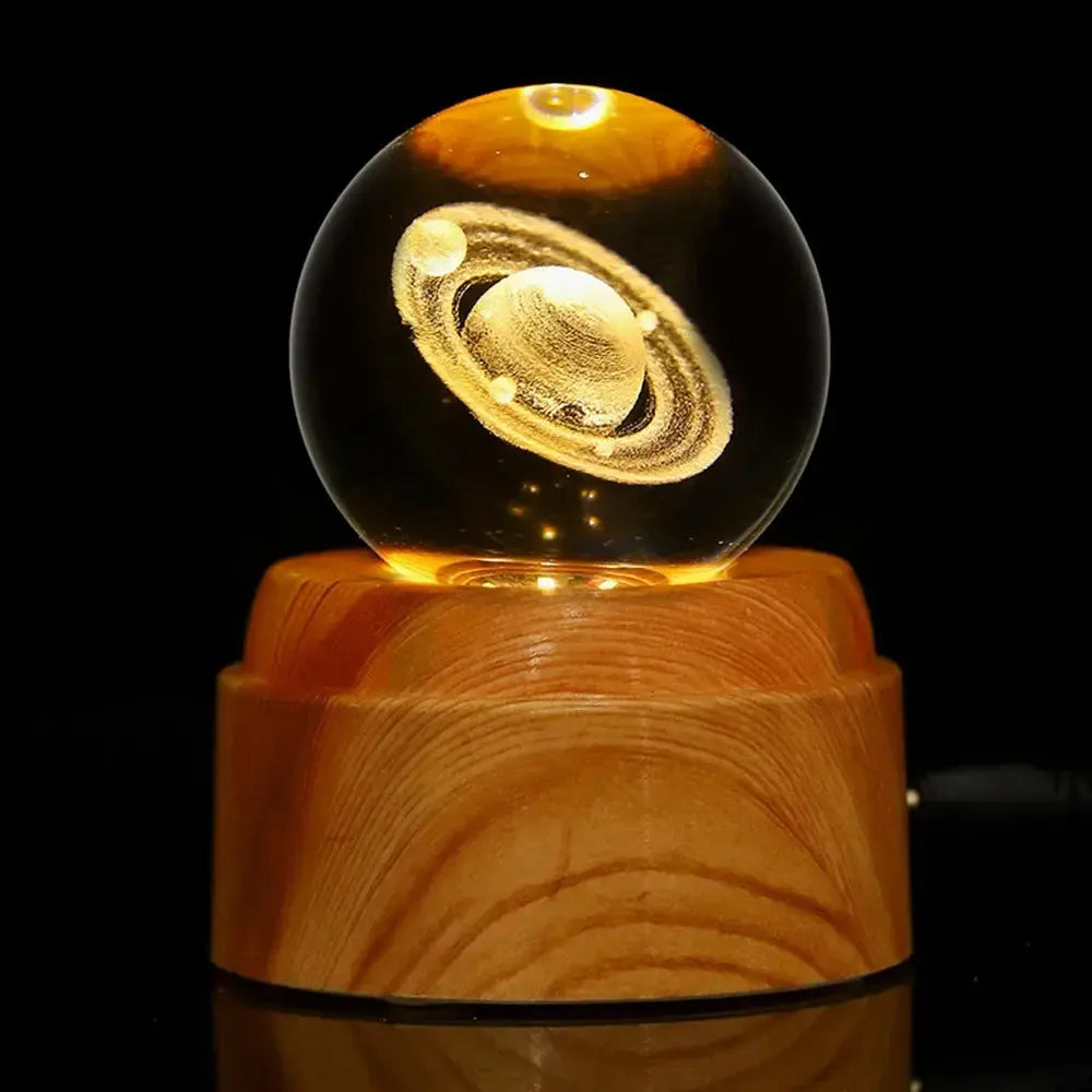 Decorative crystal lamp with a 3D moon engraving, softly glowing on a wooden base — perfect for a calming atmosphere.
