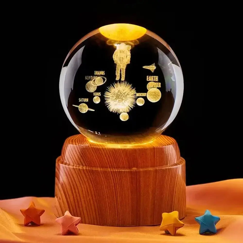 Realistic moon engraving inside a crystal sphere, lit by a warm LED on a wooden base
