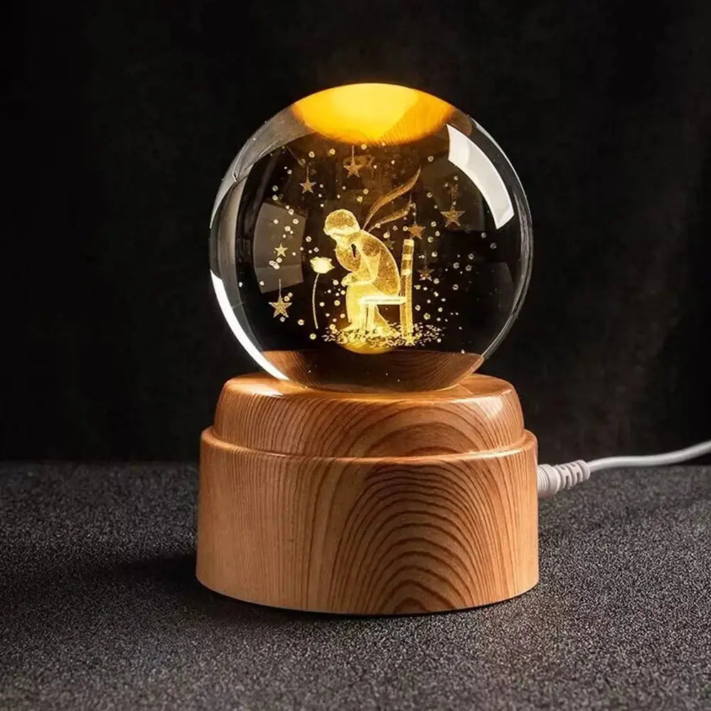 Illuminated moon orb in a crystal ball, softly glowing atop a warm-toned wooden base — ideal for bedrooms.