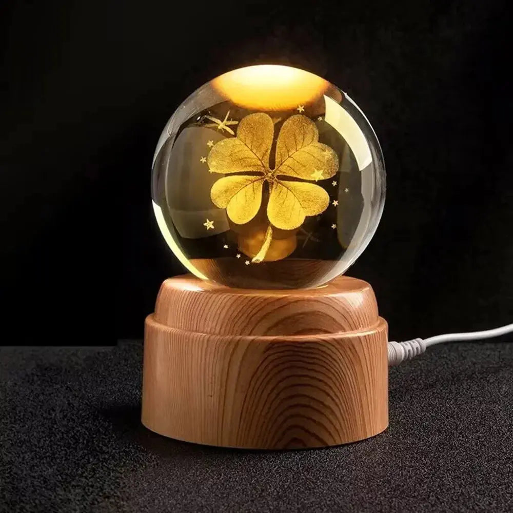 Laser-etched moon inside a crystal LED lamp, gently illuminated on a wooden base — perfect for serene spaces.