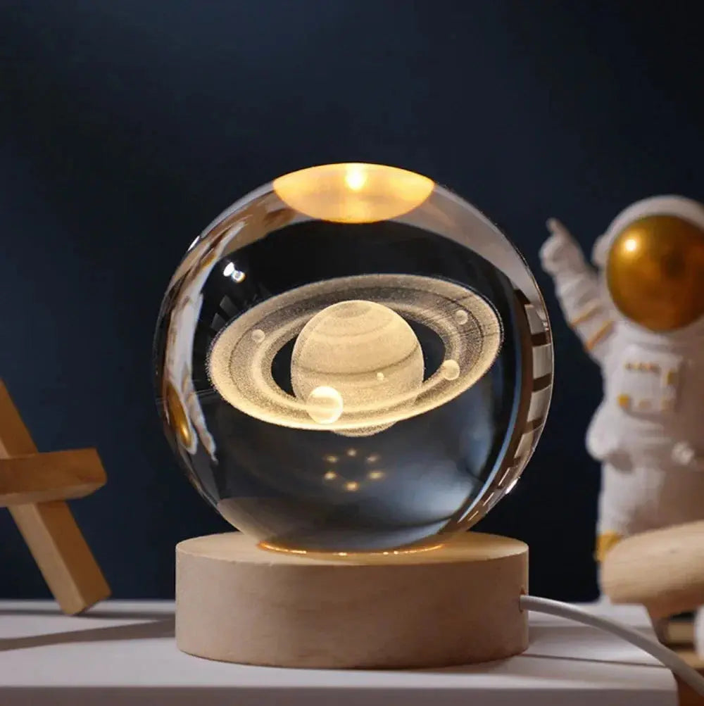 3D etched crystal lamp showing the solar system, glowing softly on a wooden base – ideal for home decor or gifting