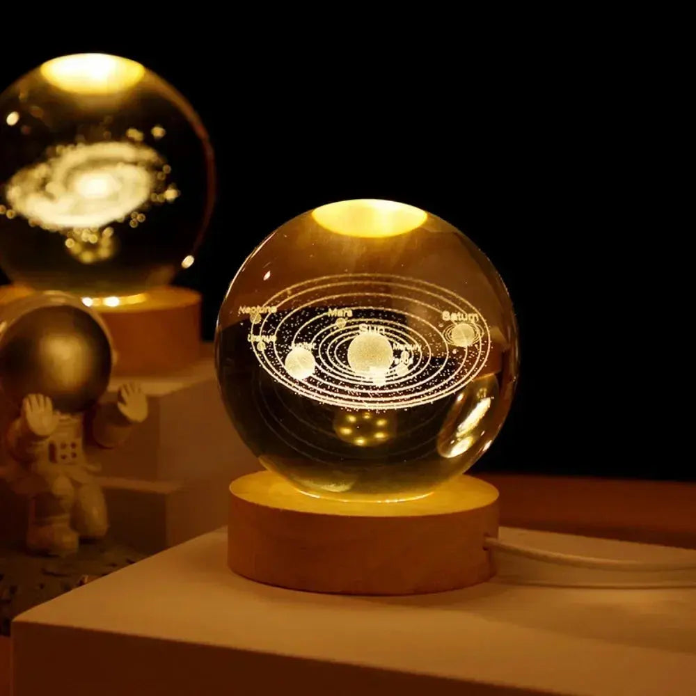 3D engraved crystal lamp of the solar system glowing gently on a wooden base — perfect for stylish home decor or a thoughtful gift.

