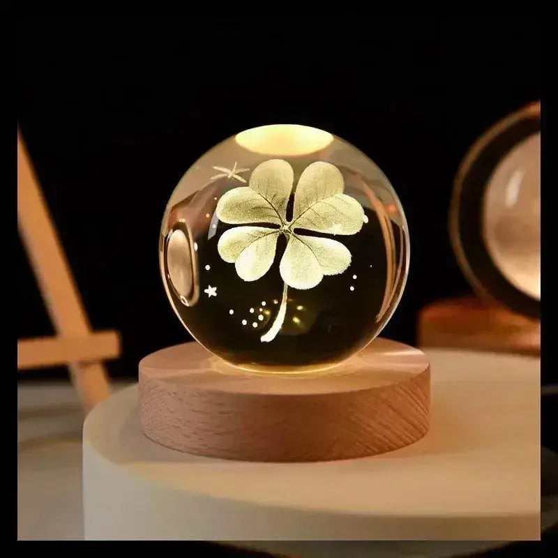 3D etched crystal lamp illustrating the solar system, softly illuminated on a wooden base — a unique decorative piece and thoughtful gift.