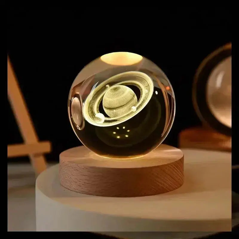 3D etched crystal lamp showcasing the solar system, glowing softly on a wooden base — ideal for ambient lighting and home decoration.

