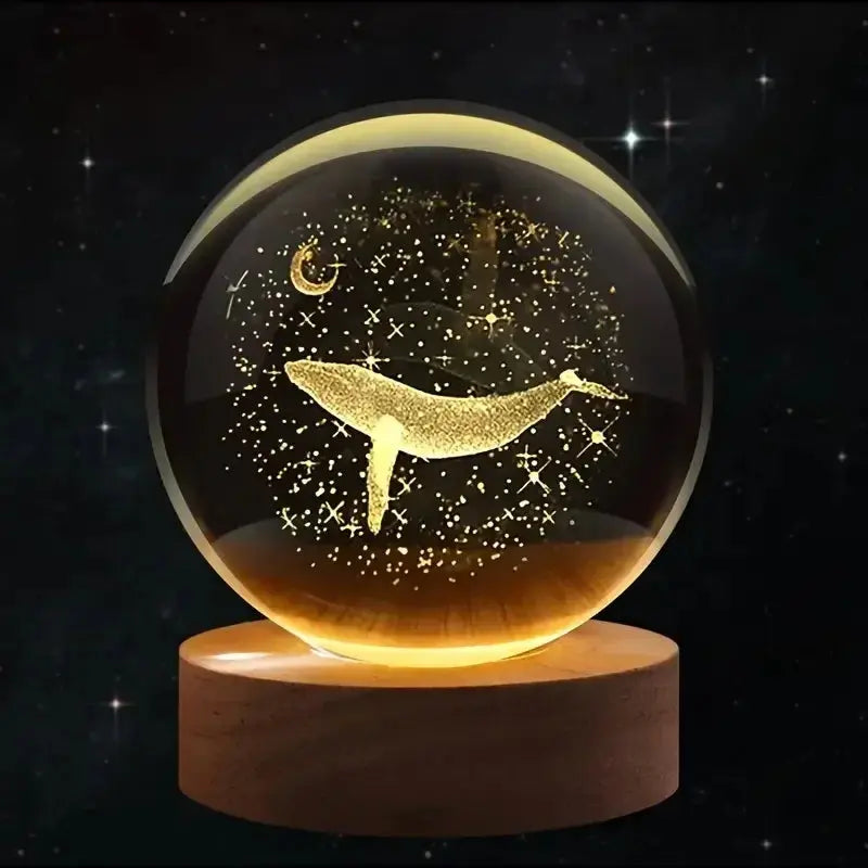 Laser-engraved 3D crystal ball featuring a whale and moon with LED lighting