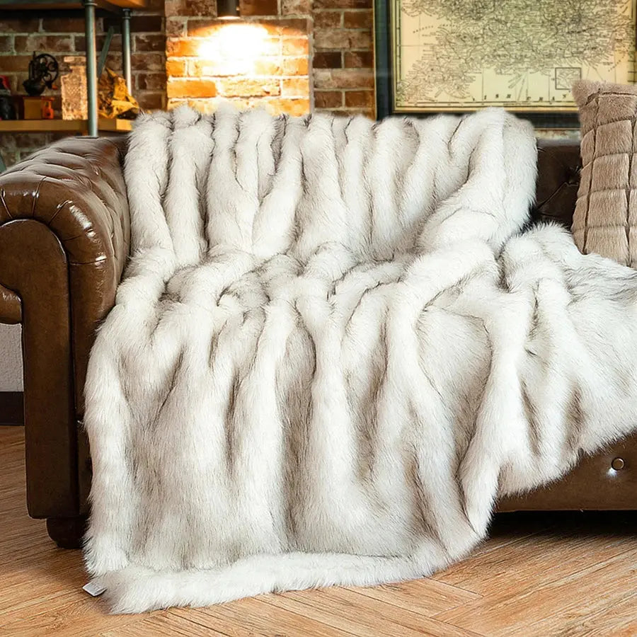 Battilo faux fur throw blanket on sofa


