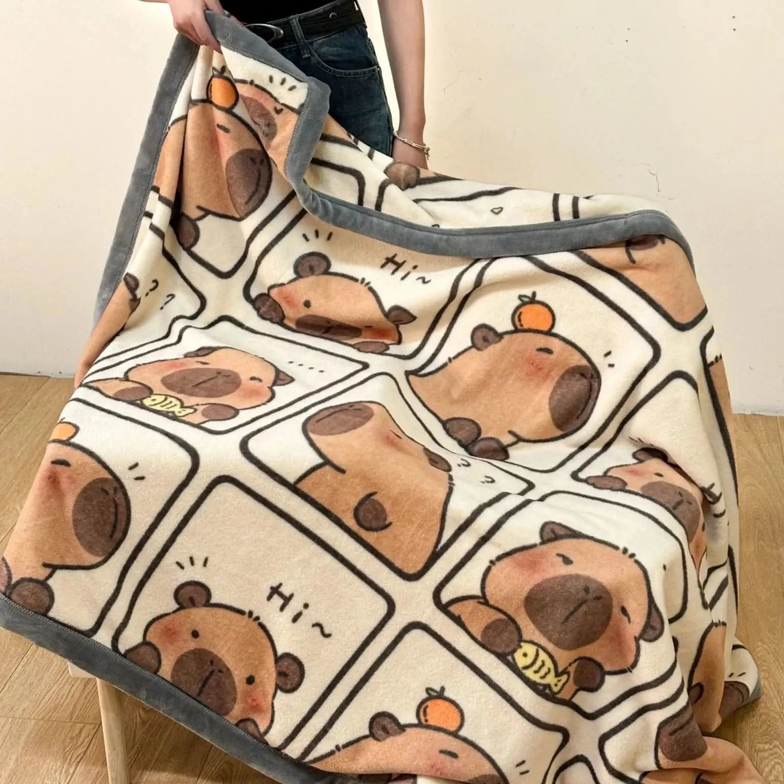 Capybara-themed throw blanket, ideal for autumn evenings or as fun décor.