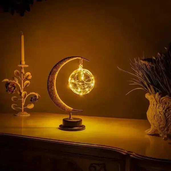 Elegant crescent moon LED lamp featuring a glowing glass globe – perfect decorative bedside or ambient light

