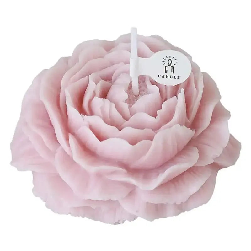 Delicate floral candle with peony scent, presented in a feminine glass jar for gifting.