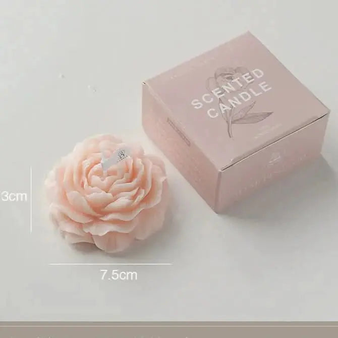 Subtle floral-scented candle in elegant packaging, great for family gifts or birthdays.