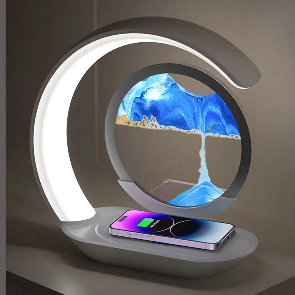 Modern Quicksand LED desk lamp with built-in wireless charger and blue hourglass sand art ornament – stylish ambient light for office or bedroom

