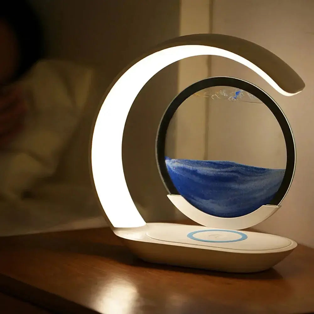 Innovative LED lamp with a magnetic hourglass that appears to float in mid-air, being adjusted by a hand.

