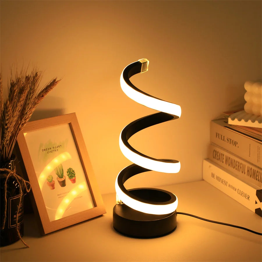 Warm white LED lamp on wooden bedside table

