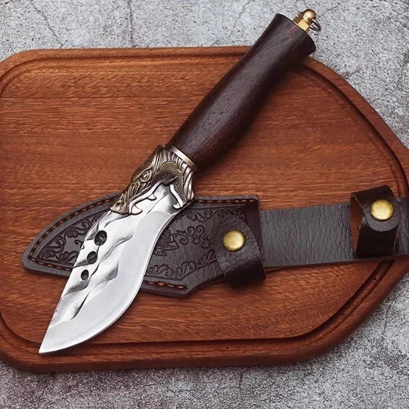 Wood handle butcher knife resting on cutting board