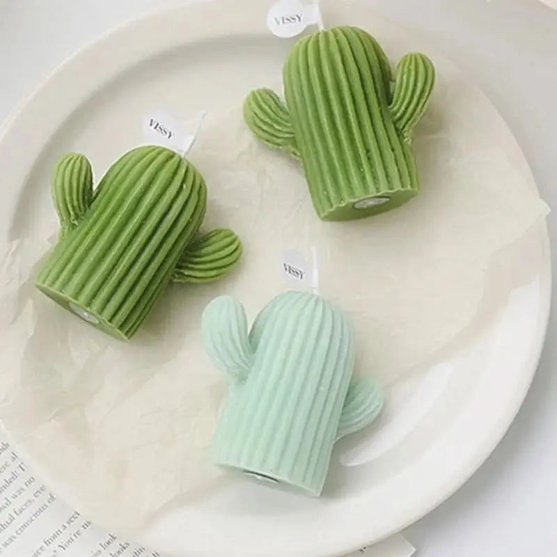Scented wax candle shaped like a cactus, ideal for eco or nature-inspired interiors.

