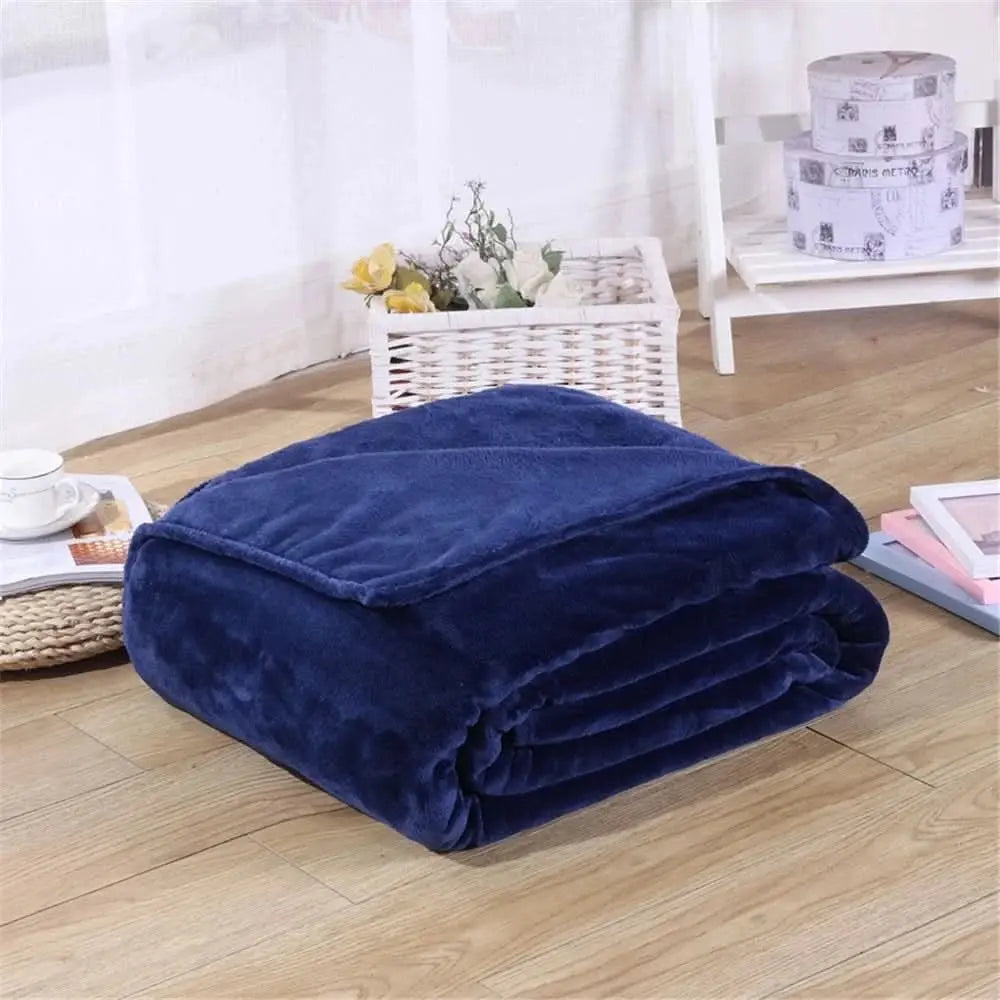 Warm and breathable flannel blanket made from soft coral fleece in solid tones.