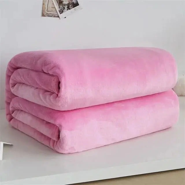 Soft-touch coral fleece blanket ideal for bedrooms, living rooms or TV time.