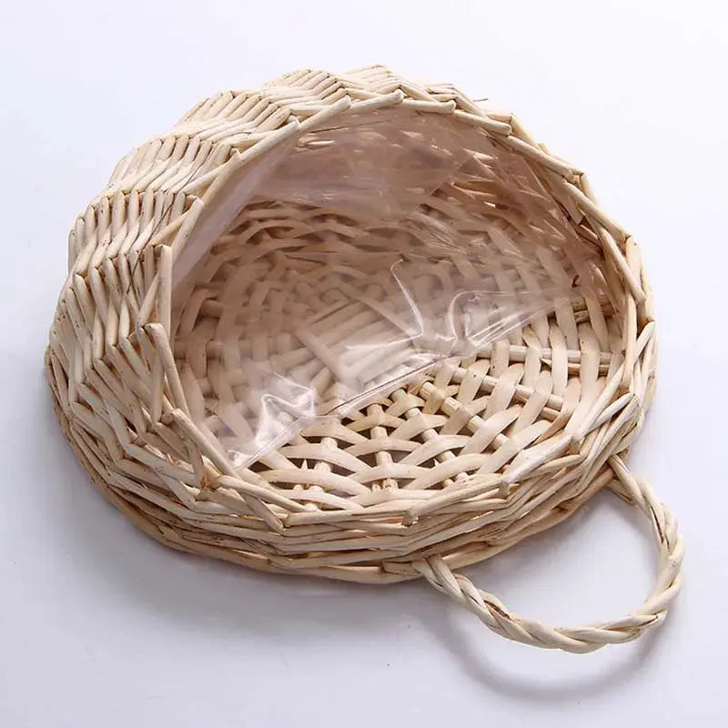 Natural woven planter mounted on outdoor wall

