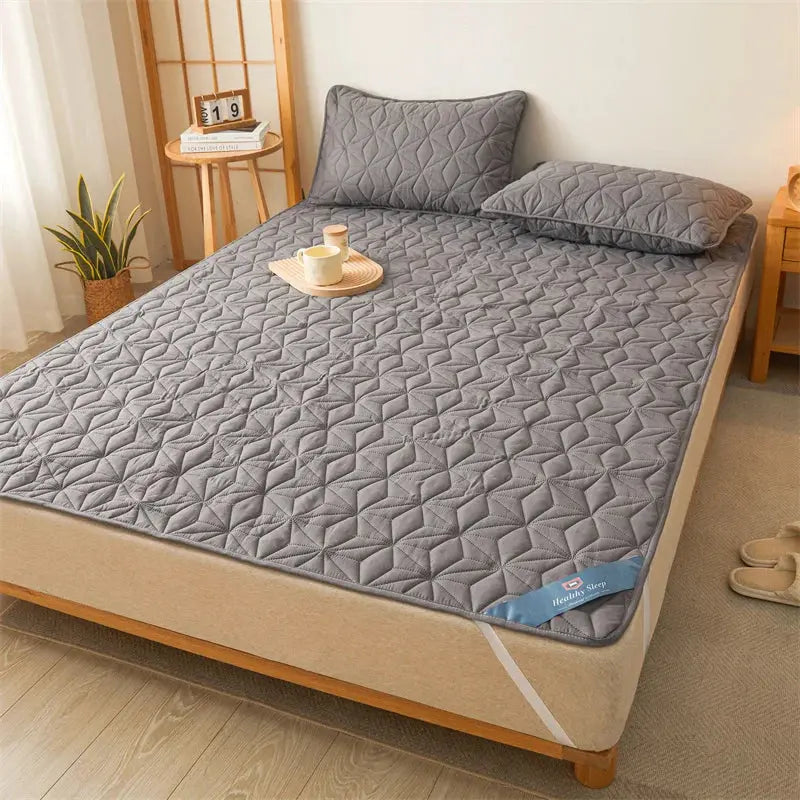 Anti-spill quilted topper for bedroom comfort